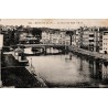 Carte postale ancienne de Bayonne montrant la Nive et les ponts du centre historique.