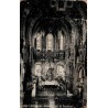 Carte postale ancienne montrant l'intérieur de la basilique de Lourdes avec la nef et le maître-autel.