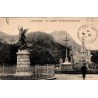 Carte postale ancienne de Lourdes montrant Saint Michel, l'esplanade et la basilique en 1925.