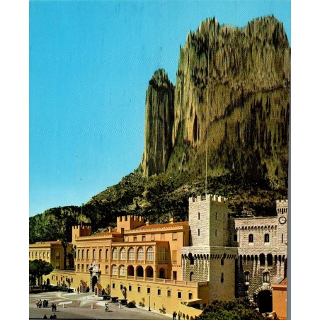 Carte postale moderne représentant le Palais Princier de Monaco avec les falaises du Rocher en arrière-plan.