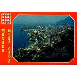 Carte postale moderne représentant une vue nocturne panoramique de Monte-Carlo avec le port illuminé et le littoral monégasque.
