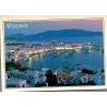 Carte Postale Moderne de Mykonos montrant le port illuminé au crépuscule, voyagée en 1998 avec timbre grec de 90 drachmes.