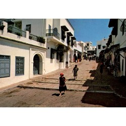 CPSM Sidi Bou Saïd rue du souk avec maisons blanches et boutiques traditionnelles en Tunisie