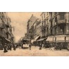 CPA Nancy rue Saint-Dizier Point Central avec tramway et commerces animés