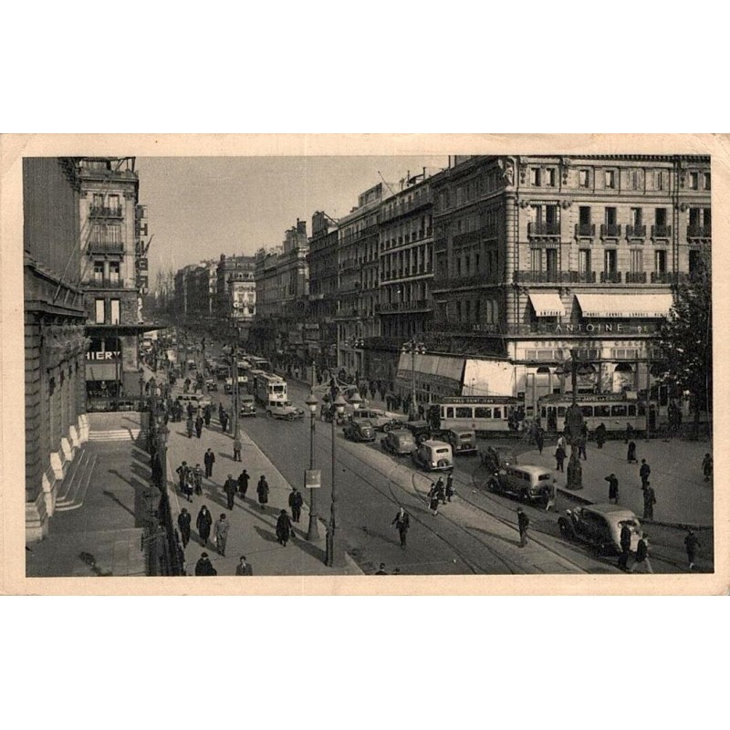 CPSM Marseille La Canebière avec tramways, automobiles et animation urbaine