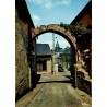 CPSM Treignac-sur-Vézère Corrèze vieille porte en pierre et vue sur la cité