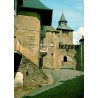 CPSM Corrèze porte fortifiée et clocher vue du vieux bourg circulée en 1987
