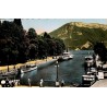 Carte postale ancienne d’Annecy montrant le port avec le Mont Veyrier en arrière-plan en Haute-Savoie